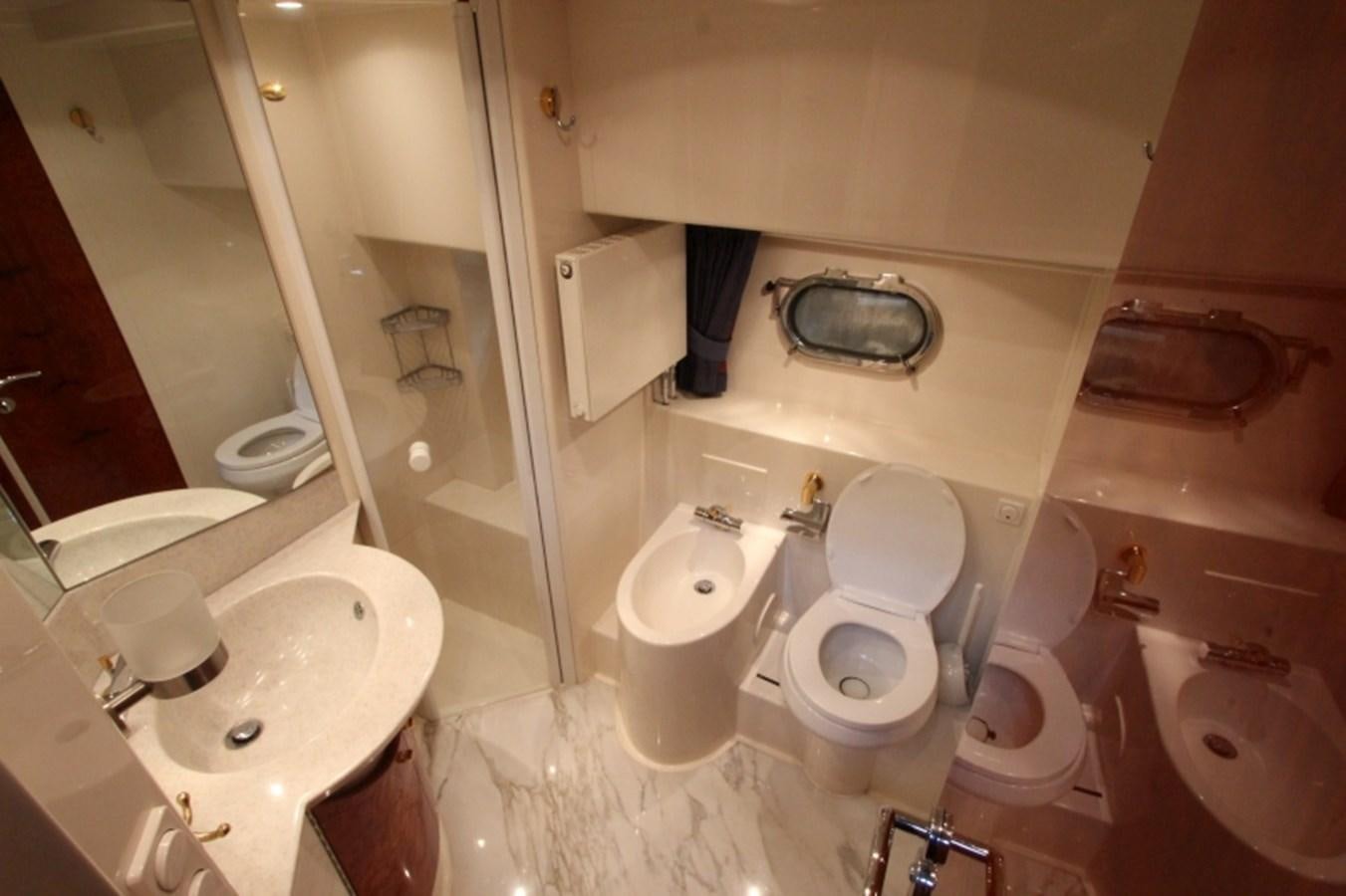 a bathroom with a toilet and sink aboard THE RIVER Yacht for Sale