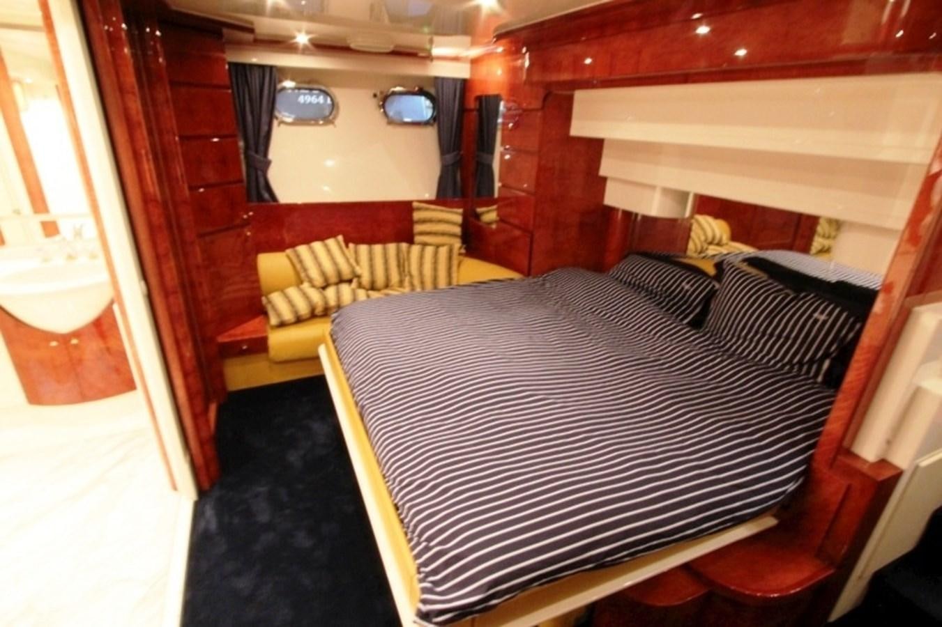 a bed in a room aboard THE RIVER Yacht for Sale
