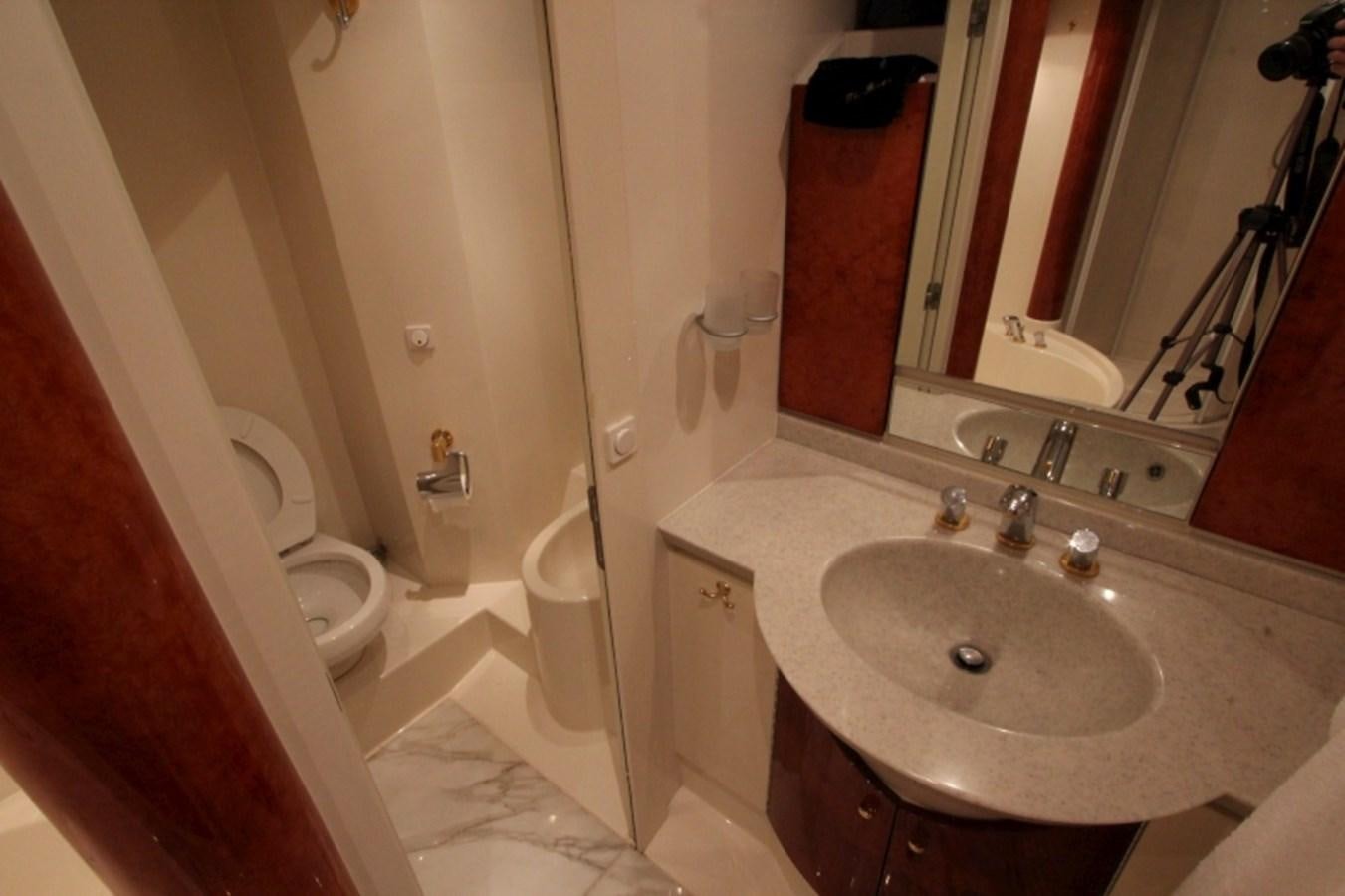 a bathroom with a sink and a mirror aboard THE RIVER Yacht for Sale