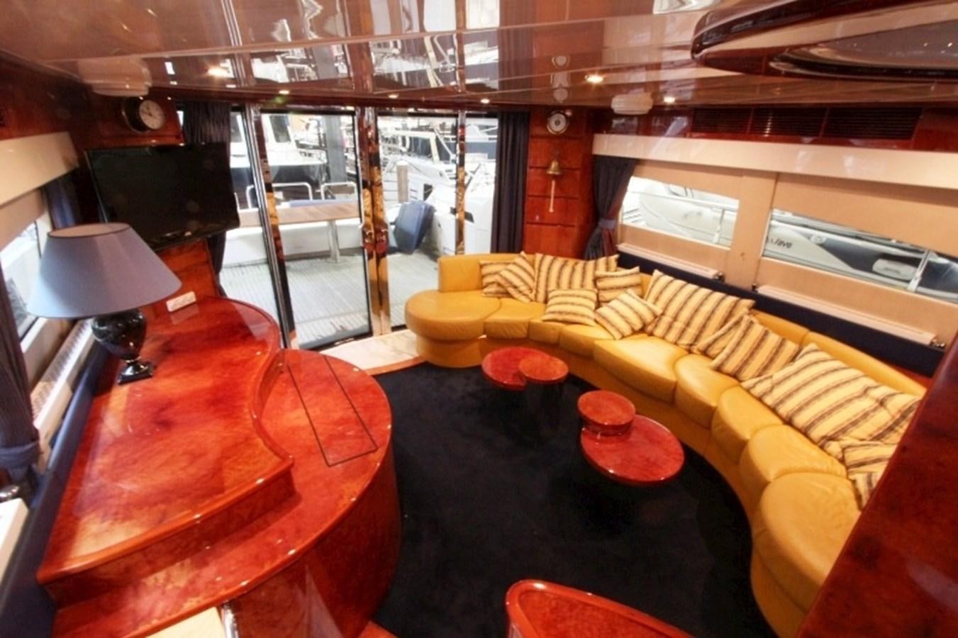 a room with a table and chairs aboard THE RIVER Yacht for Sale