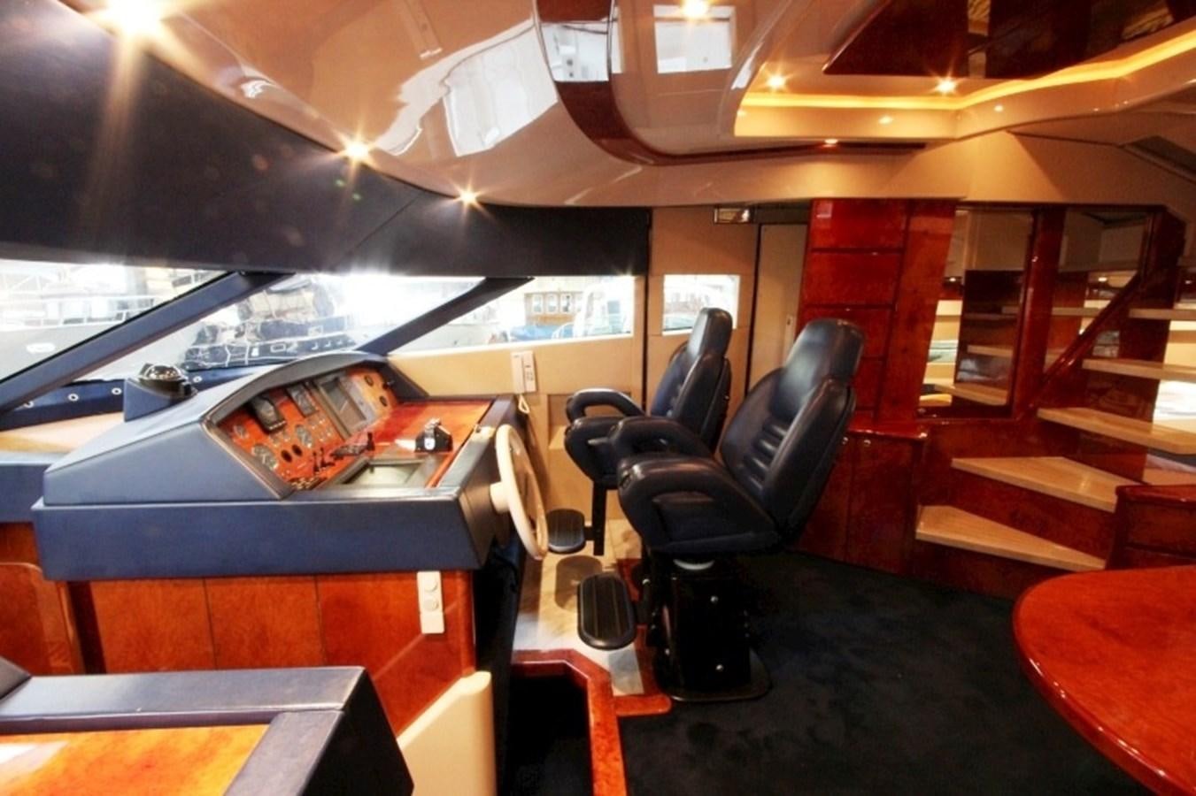 a room with a table and chairs aboard THE RIVER Yacht for Sale