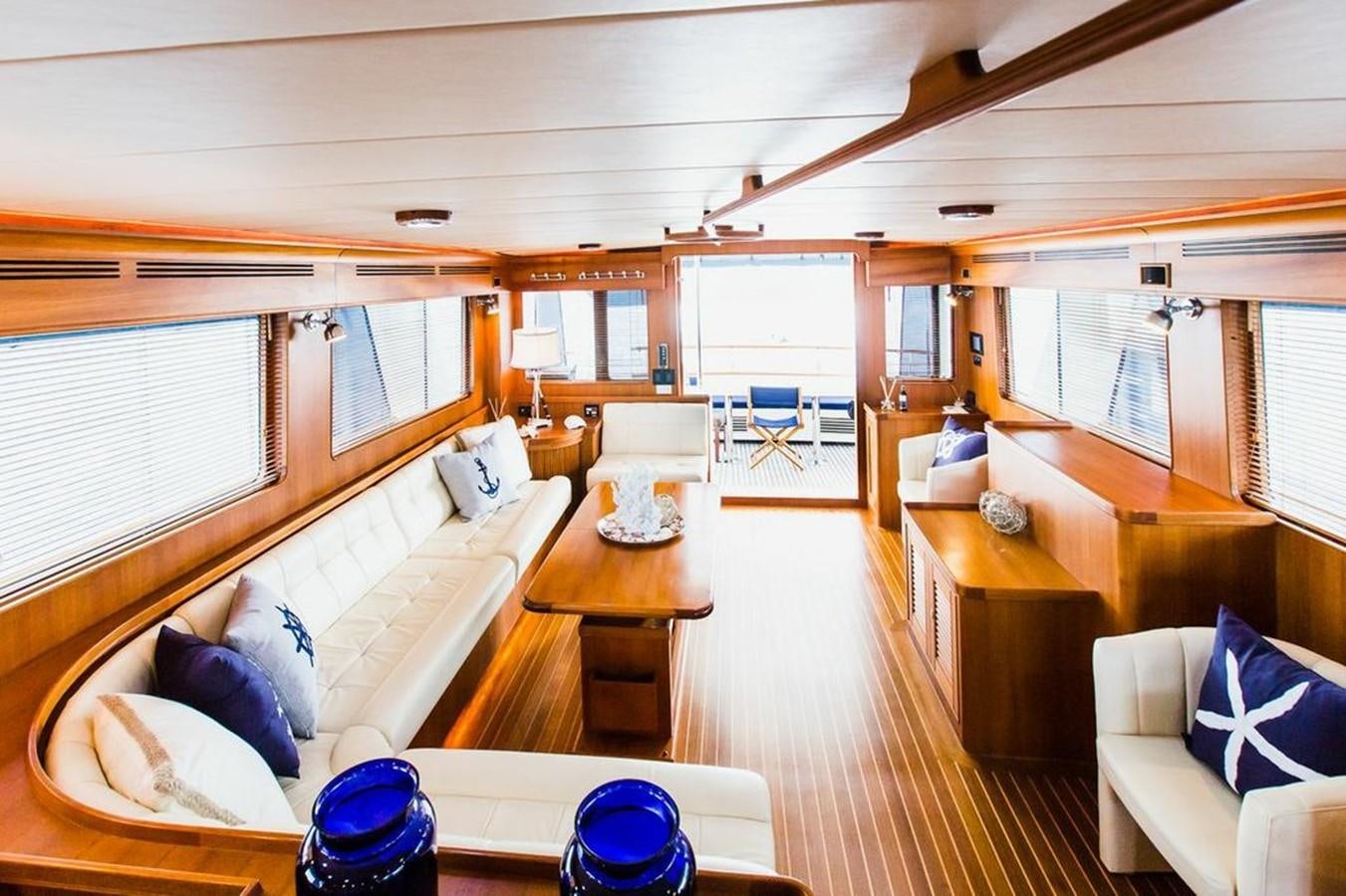 a room with a bed and a table aboard 72' MARLOW RAISED PILOTHOUSE MOTOR YACHT EXPLORER I Yacht for Sale