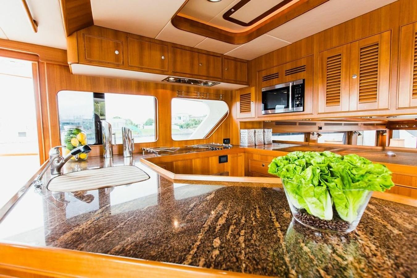 a kitchen with marble counter tops aboard 72' MARLOW RAISED PILOTHOUSE MOTOR YACHT EXPLORER I Yacht for Sale