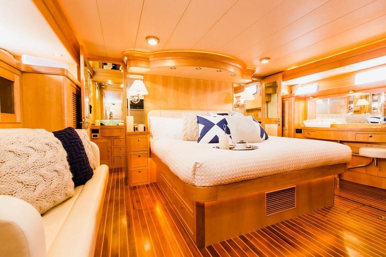 a room with a bed and a mirror aboard 72' MARLOW RAISED PILOTHOUSE MOTOR YACHT EXPLORER I Yacht for Sale