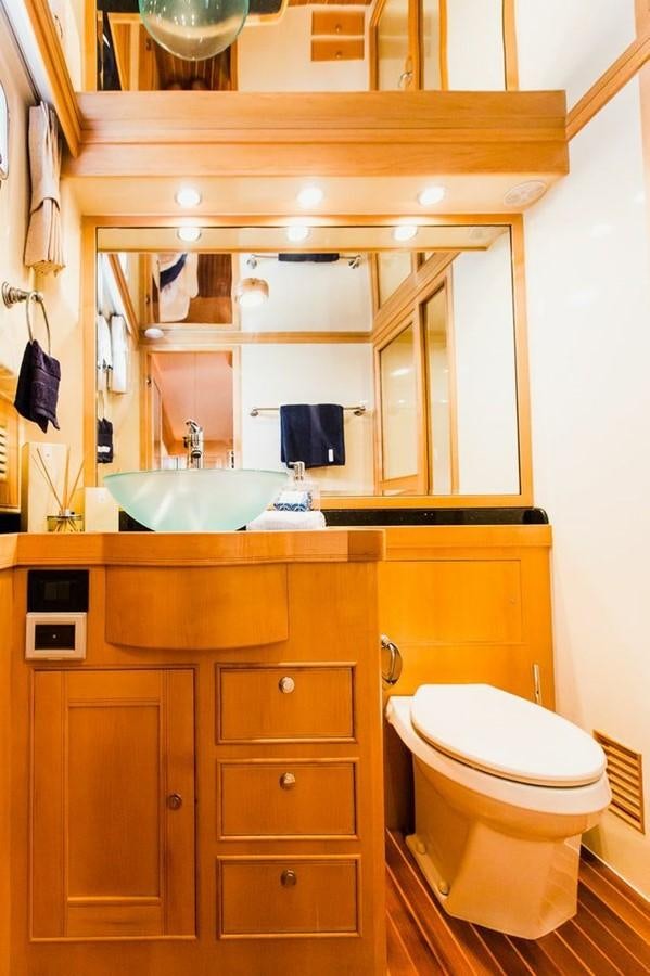 a bathroom with a sink and a toilet aboard 72' MARLOW RAISED PILOTHOUSE MOTOR YACHT EXPLORER I Yacht for Sale