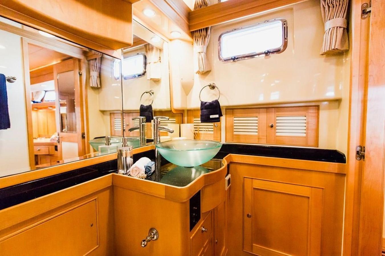 a kitchen with a sink and cabinets aboard 72' MARLOW RAISED PILOTHOUSE MOTOR YACHT EXPLORER I Yacht for Sale