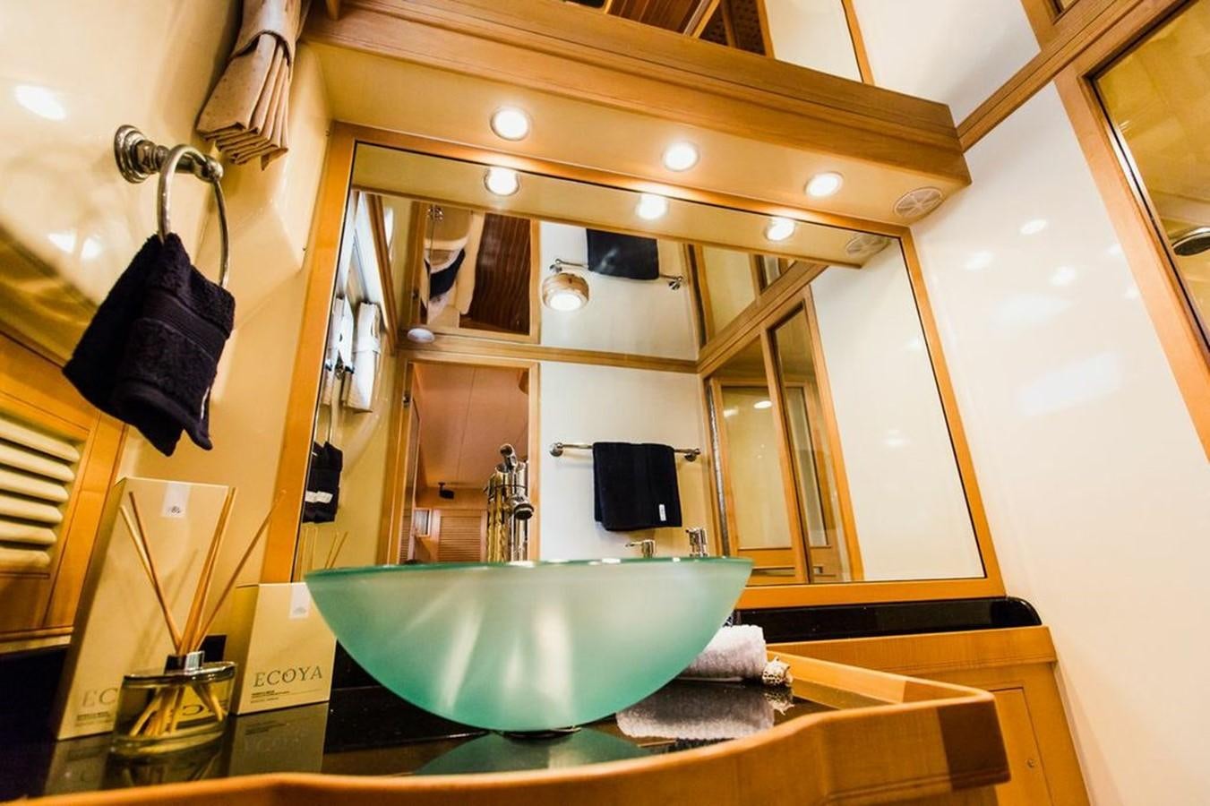 a bathroom with a large mirror aboard 72' MARLOW RAISED PILOTHOUSE MOTOR YACHT EXPLORER I Yacht for Sale
