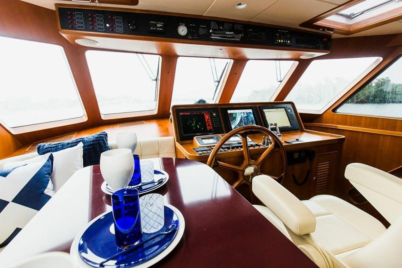 a room with a table and chairs aboard 72' MARLOW RAISED PILOTHOUSE MOTOR YACHT EXPLORER I Yacht for Sale