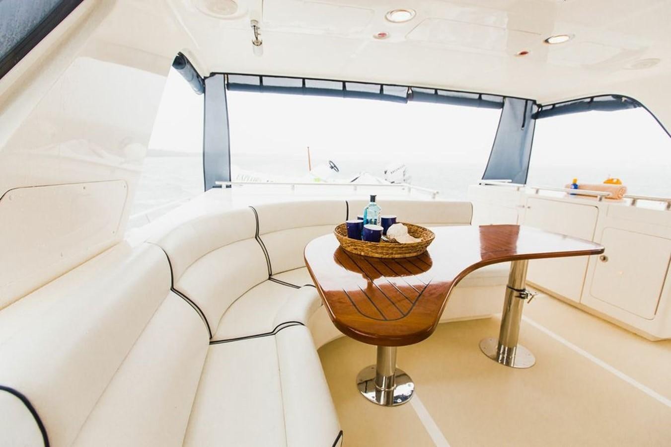 a room with a table and chairs aboard 72' MARLOW RAISED PILOTHOUSE MOTOR YACHT EXPLORER I Yacht for Sale