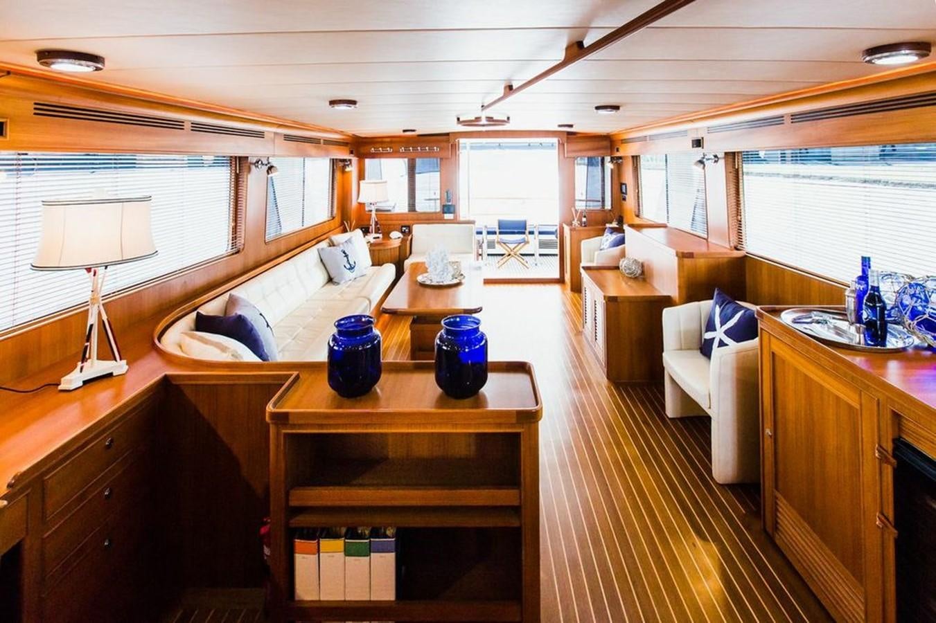 a room with a bed and a desk aboard 72' MARLOW RAISED PILOTHOUSE MOTOR YACHT EXPLORER I Yacht for Sale