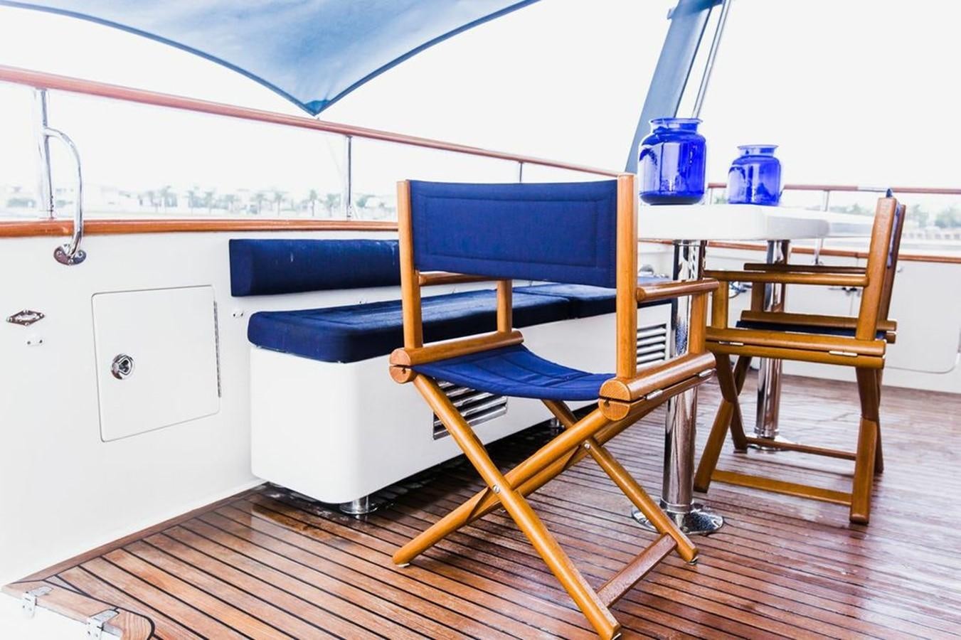a room with a bed and chairs aboard 72' MARLOW RAISED PILOTHOUSE MOTOR YACHT EXPLORER I Yacht for Sale