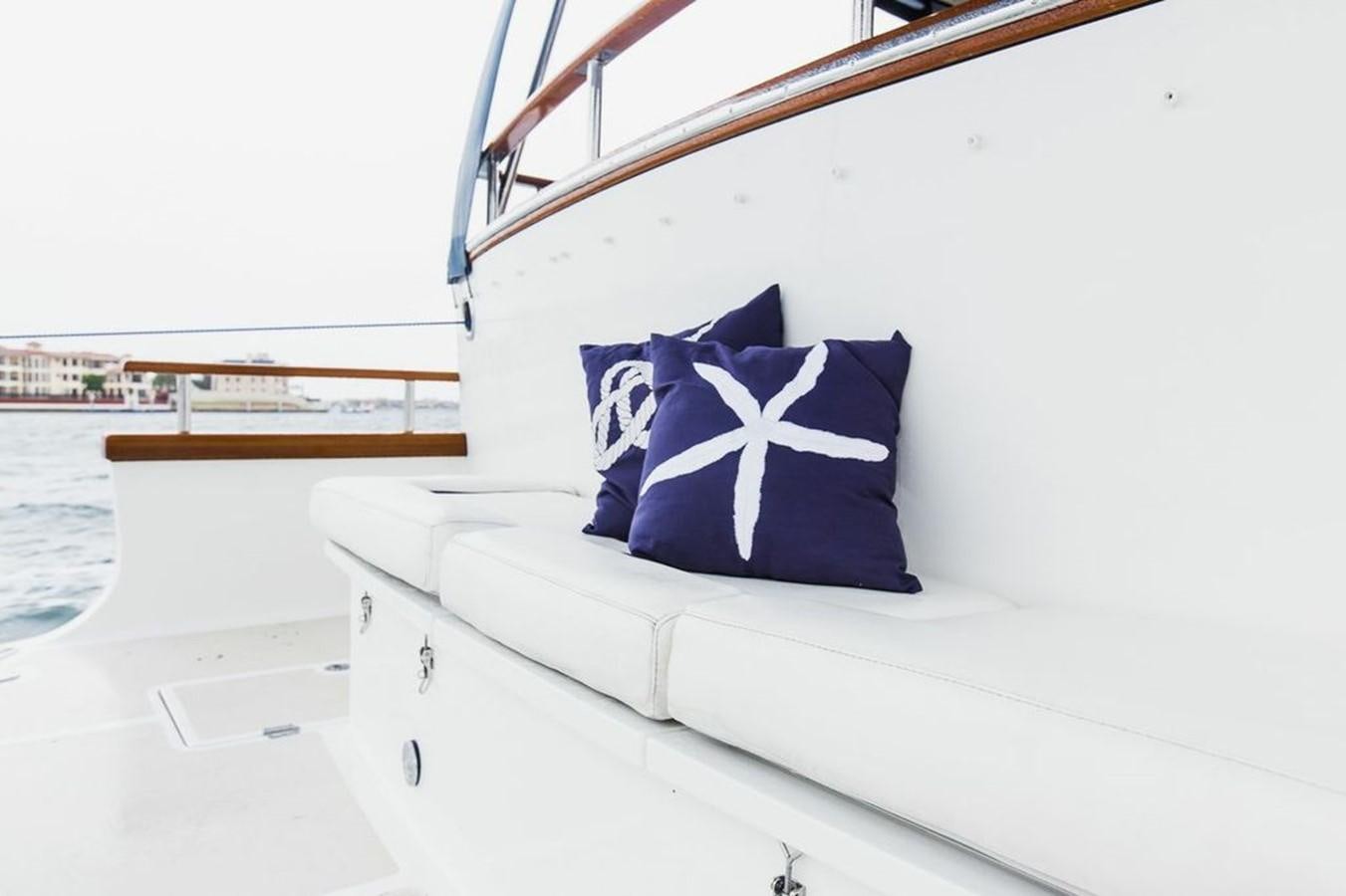 a white boat with a blue and white star on it aboard 72' MARLOW RAISED PILOTHOUSE MOTOR YACHT EXPLORER I Yacht for Sale