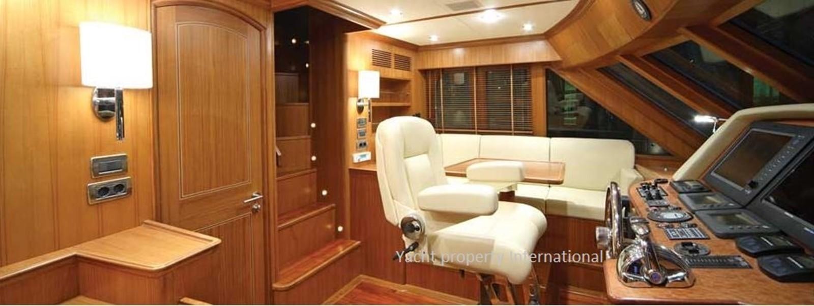a room with a desk and a chair aboard S.M Yacht for Sale