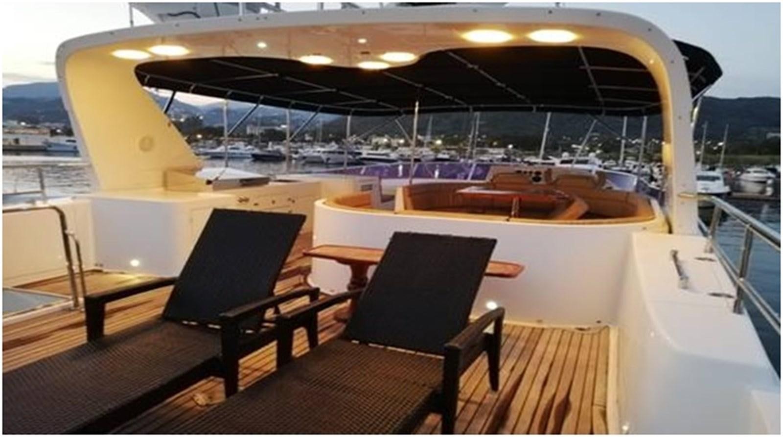 a boat with chairs on it aboard S.M Yacht for Sale