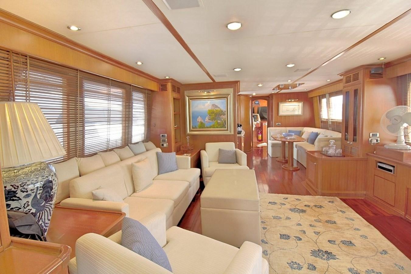 a living room with a large window aboard S.M Yacht for Sale