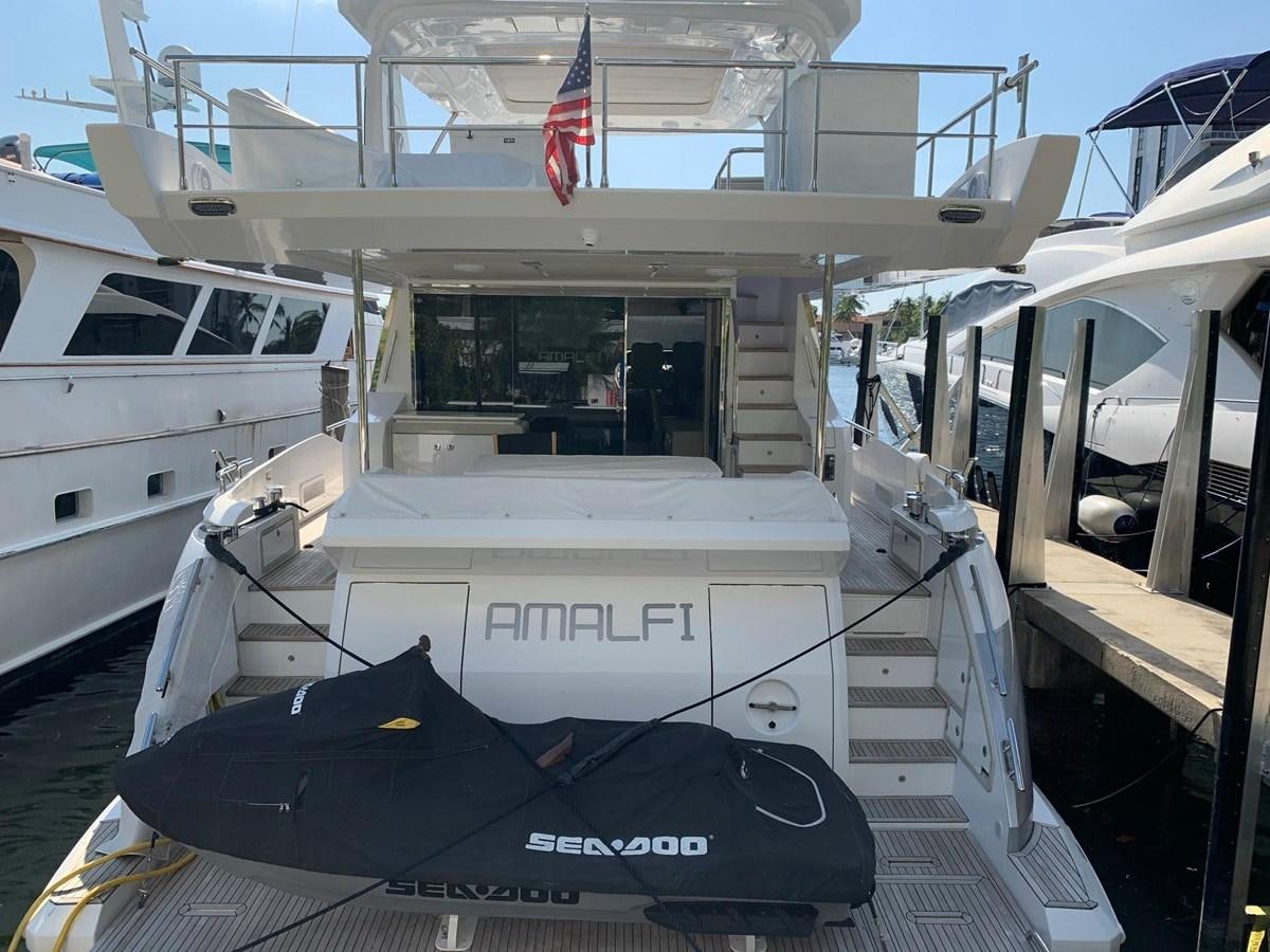 a boat docked at a pier aboard AMALFI Yacht for Sale