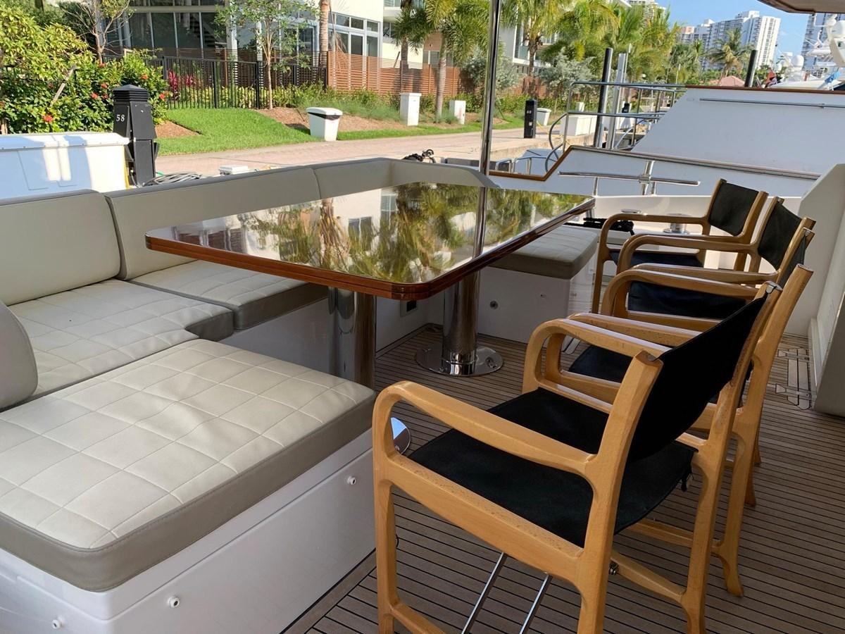 a table and chairs outside aboard AMALFI Yacht for Sale