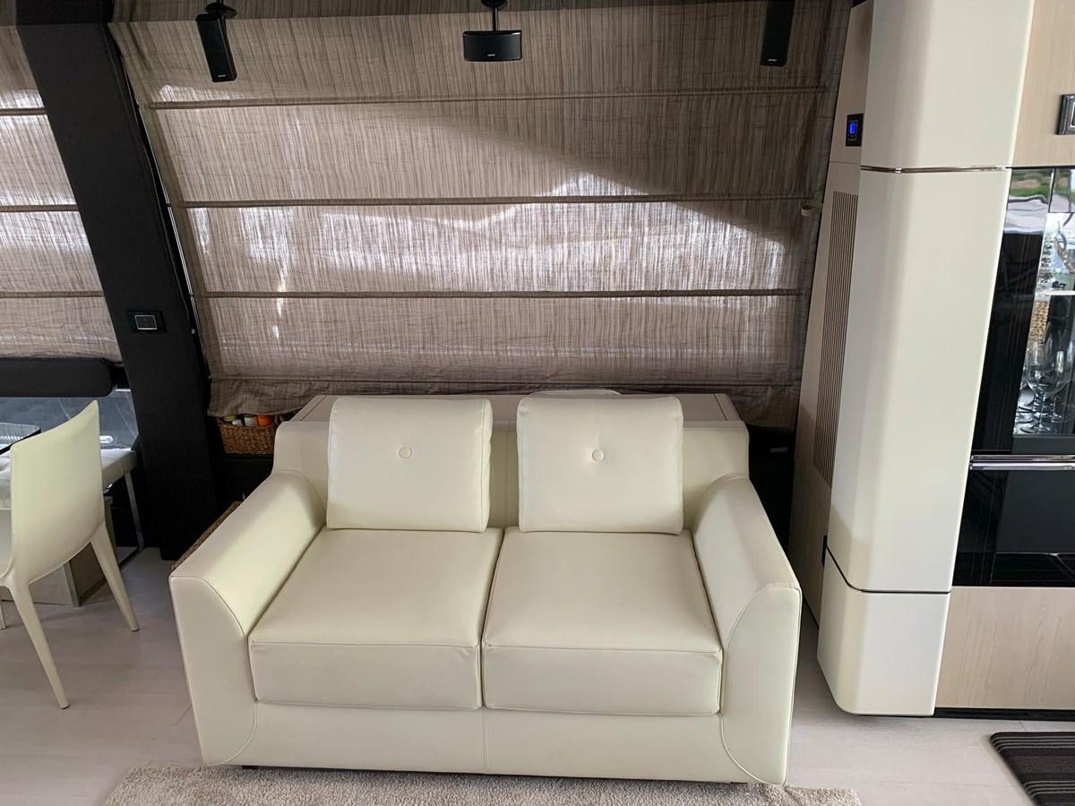 a white couch in a room aboard AMALFI Yacht for Sale