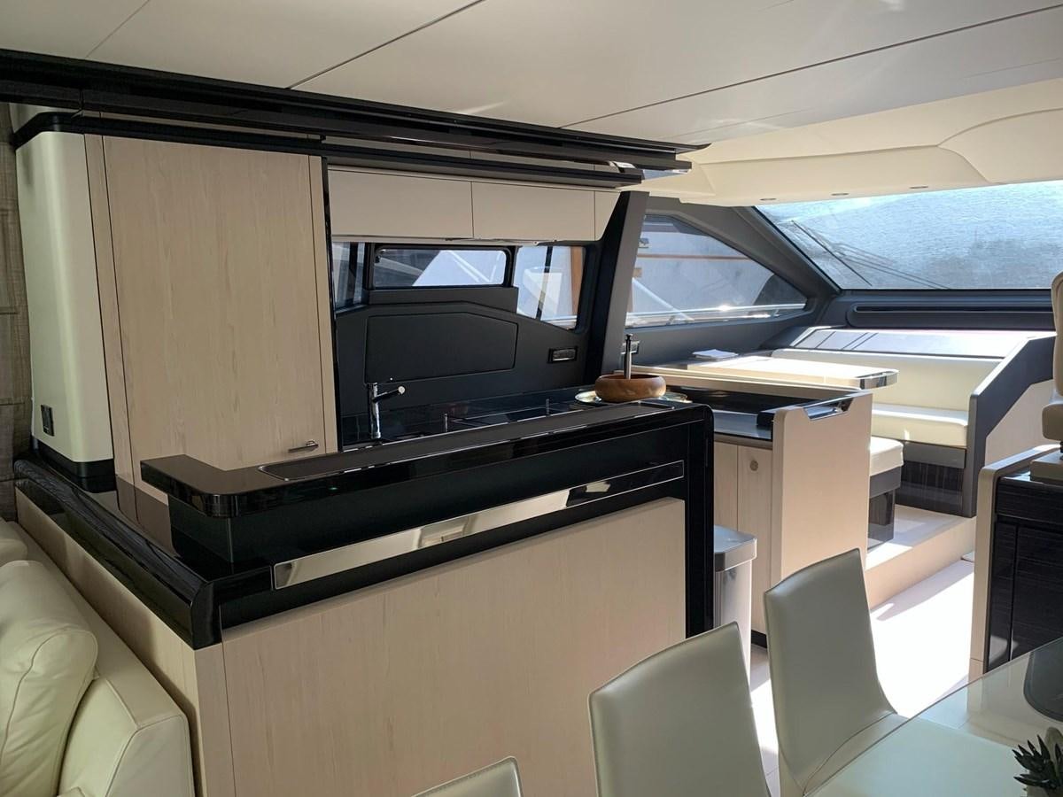 a room with a tv and a couch aboard AMALFI Yacht for Sale