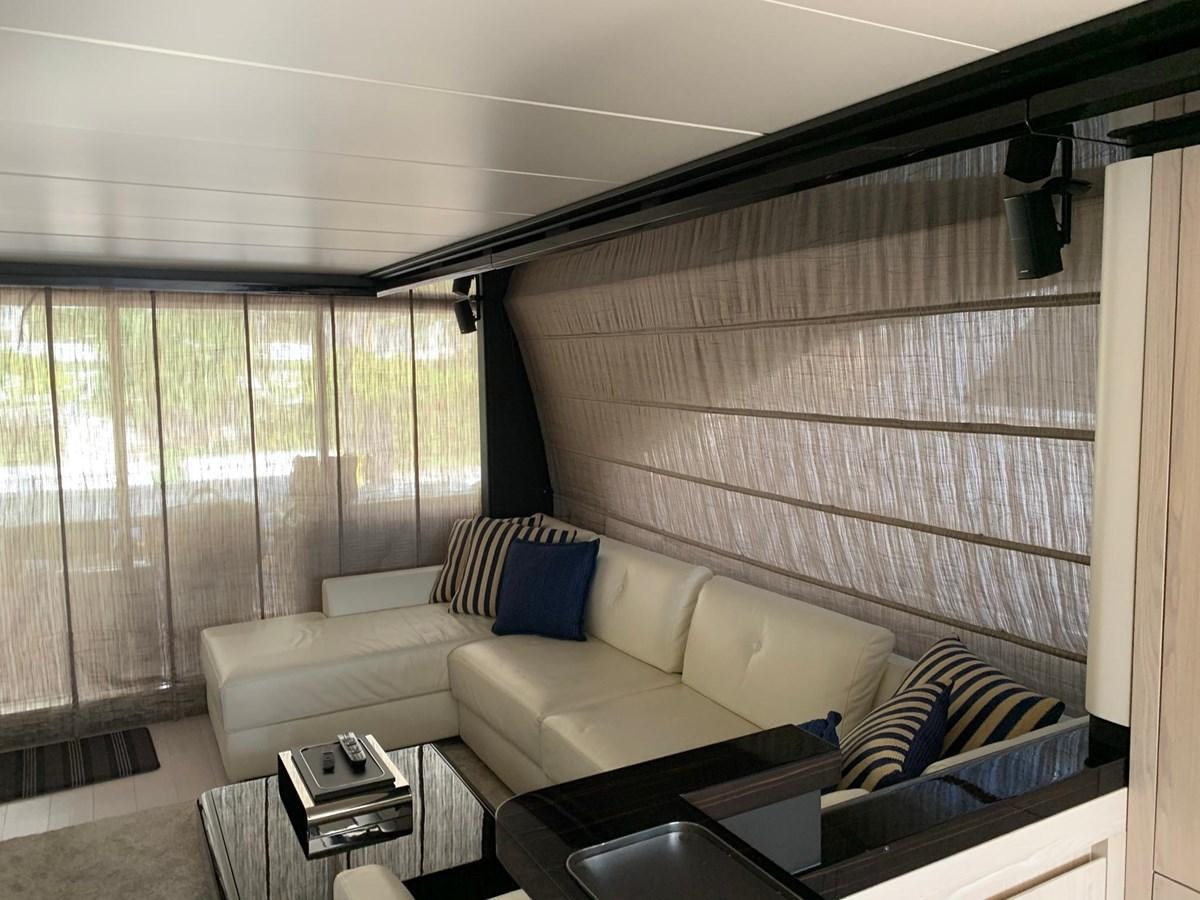 a living room with a couch and a coffee table aboard AMALFI Yacht for Sale