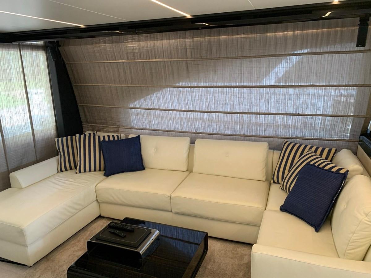 a living room with a couch and a coffee table aboard AMALFI Yacht for Sale