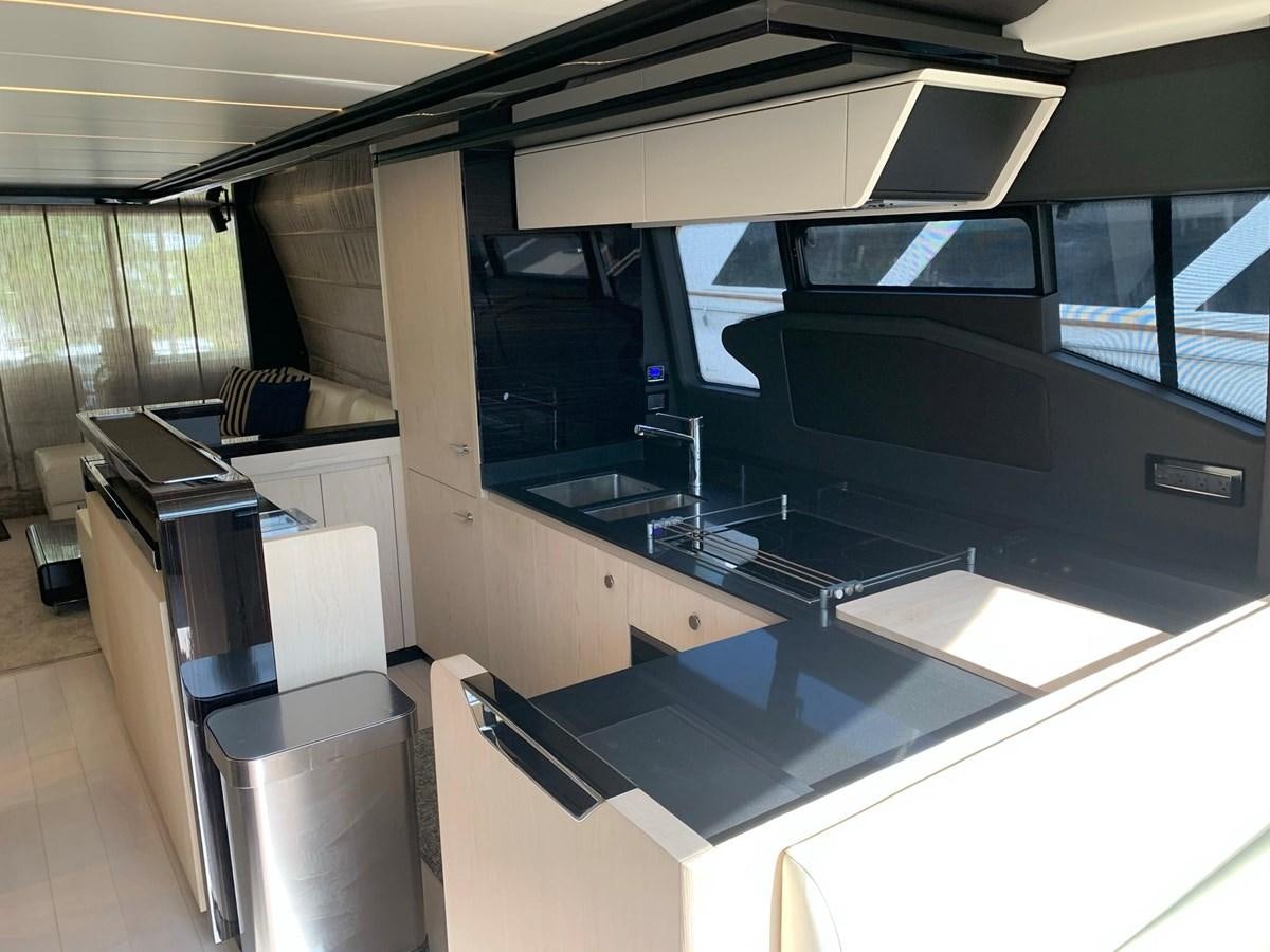 a kitchen with a large island aboard AMALFI Yacht for Sale