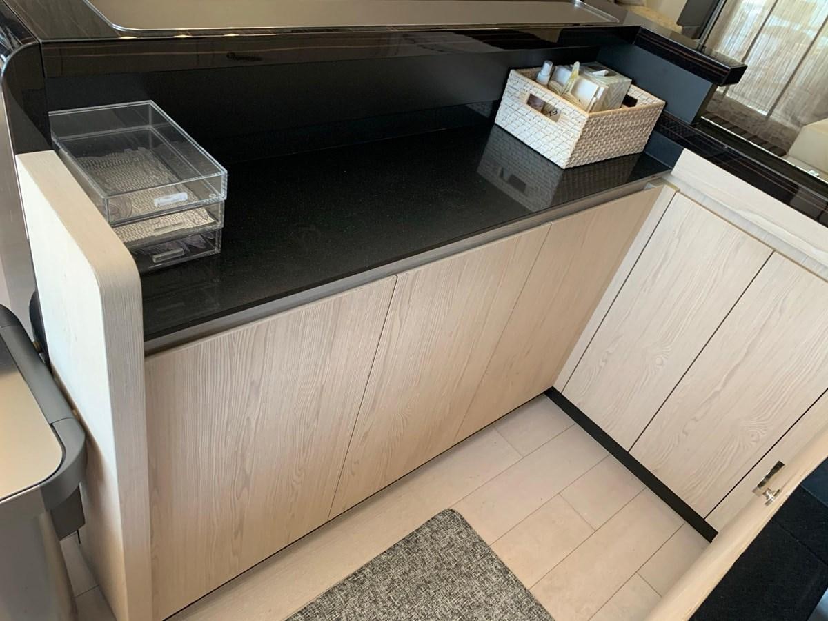 a kitchen counter with a shelf aboard AMALFI Yacht for Sale
