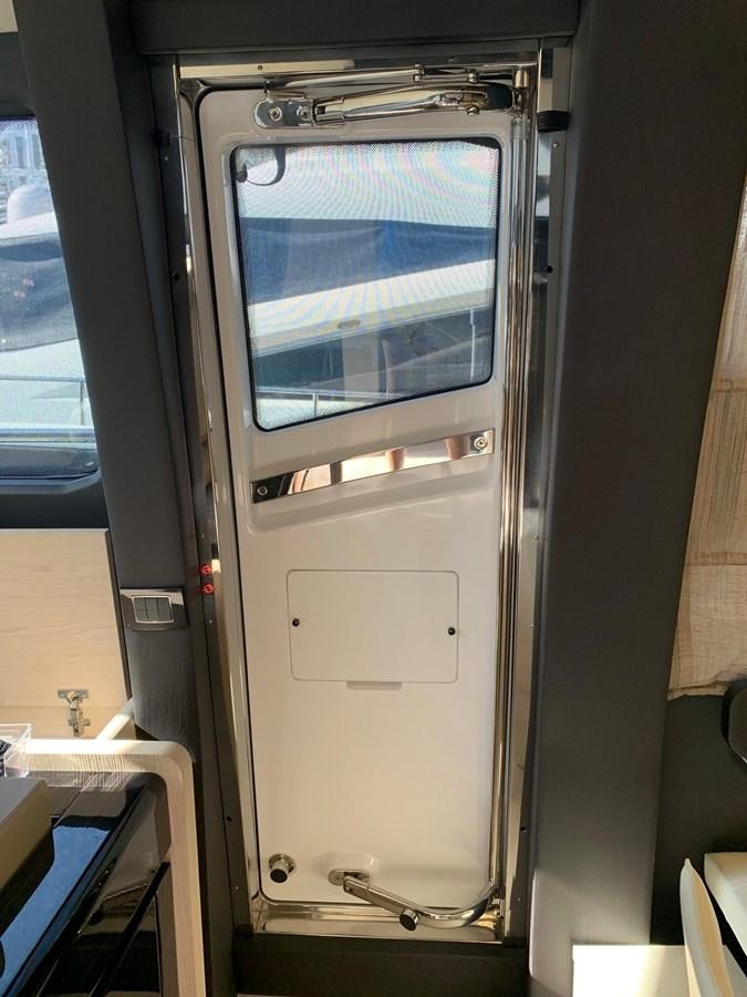 a white refrigerator in a room aboard AMALFI Yacht for Sale