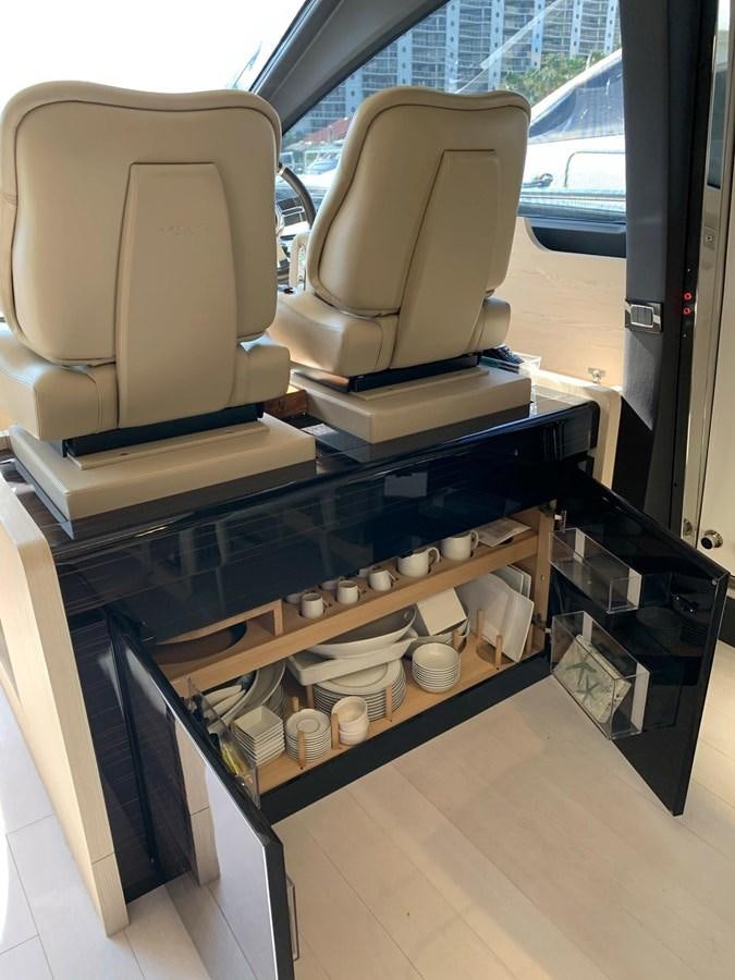 a chair and a table in a room aboard AMALFI Yacht for Sale