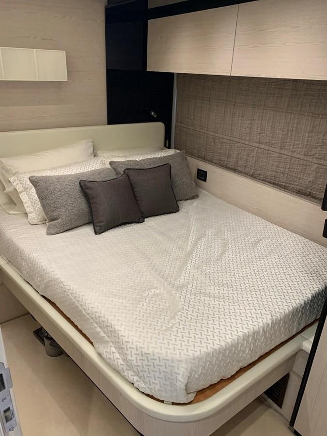 a bed with pillows aboard AMALFI Yacht for Sale