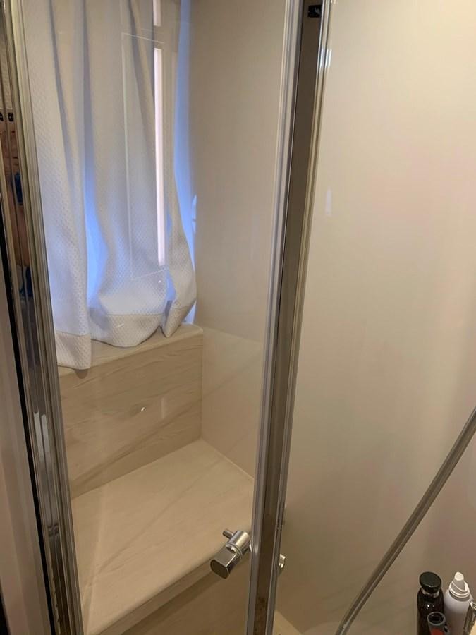 a shower curtain with a blue curtain aboard AMALFI Yacht for Sale