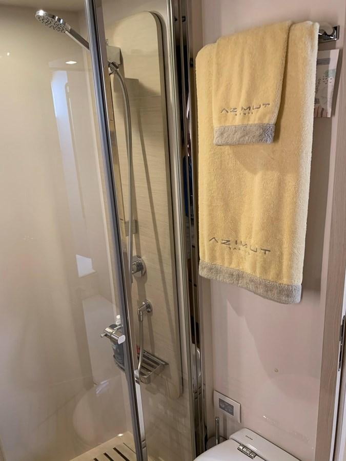 a shower with a towel on the wall aboard AMALFI Yacht for Sale