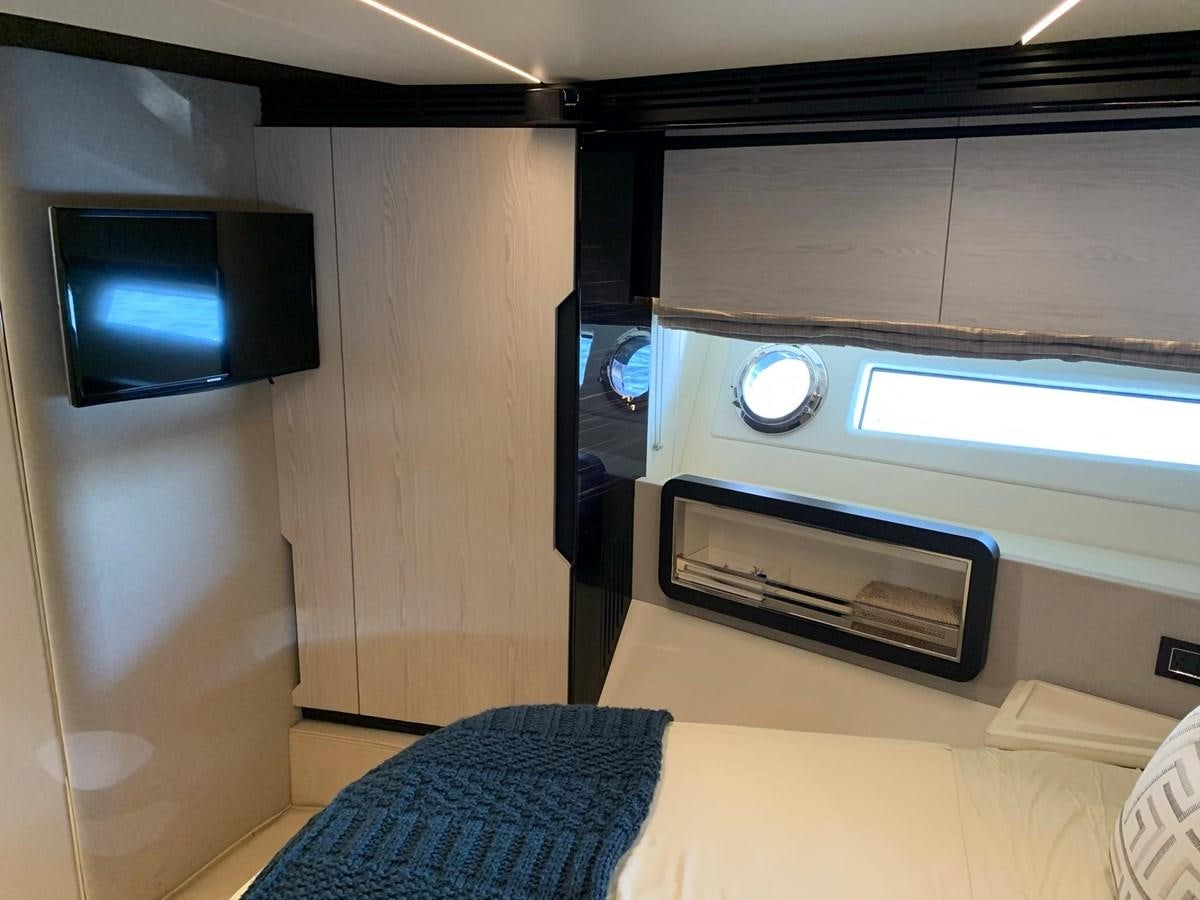 a room with a tv and a couch aboard AMALFI Yacht for Sale