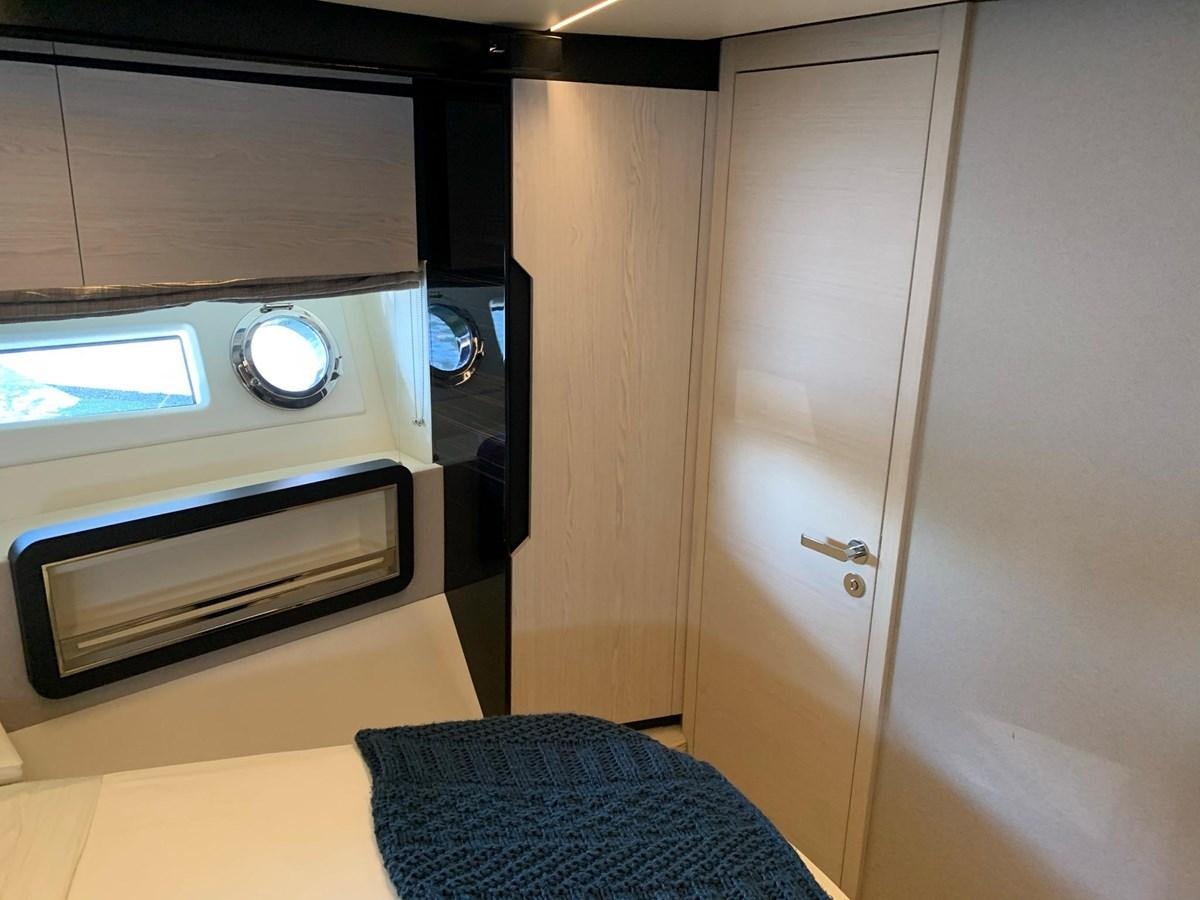 a room with a bed and a microwave aboard AMALFI Yacht for Sale