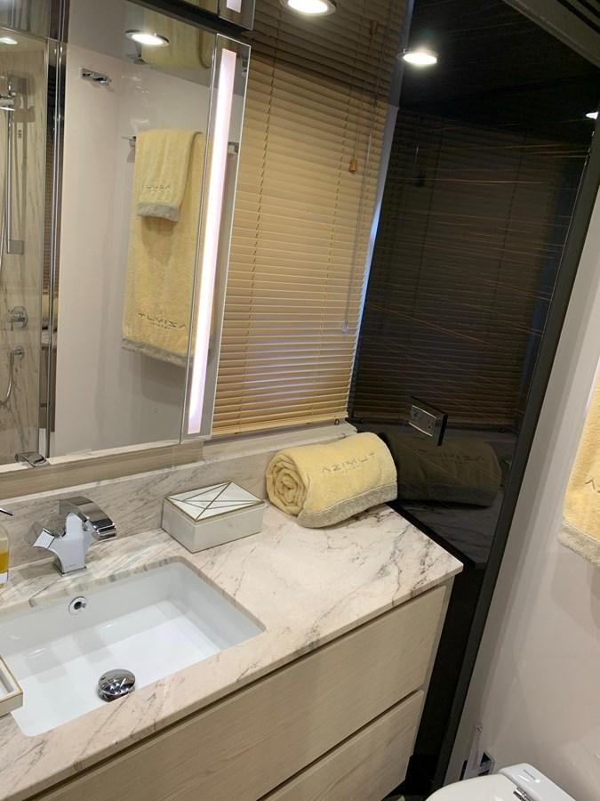 a bathroom with a large mirror aboard AMALFI Yacht for Sale