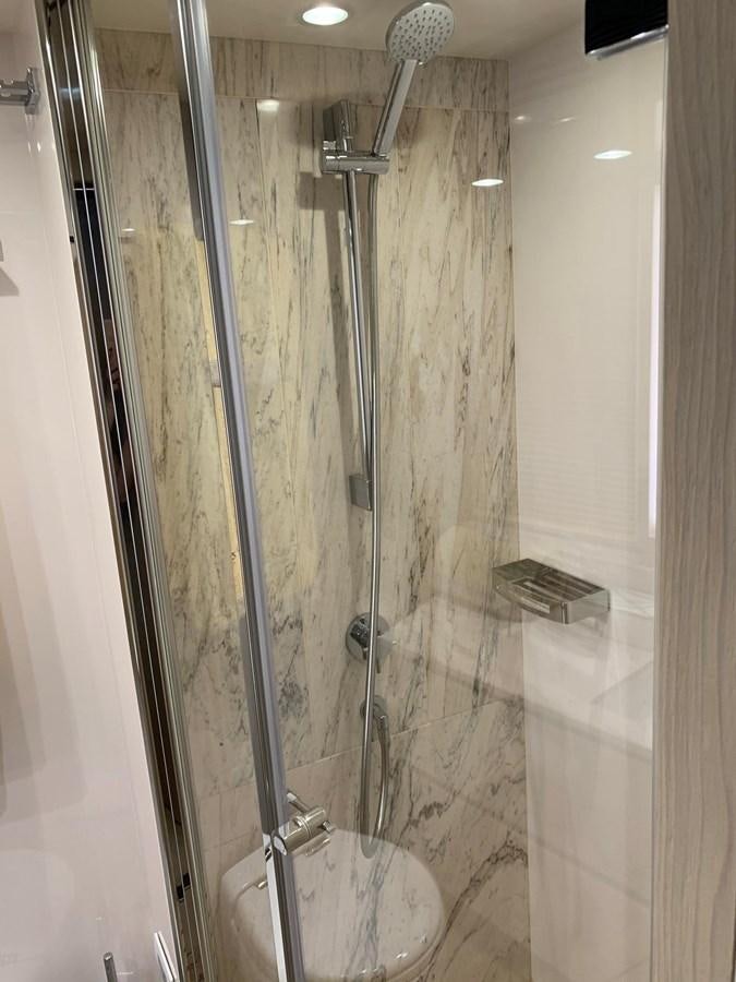 a shower with glass doors aboard AMALFI Yacht for Sale