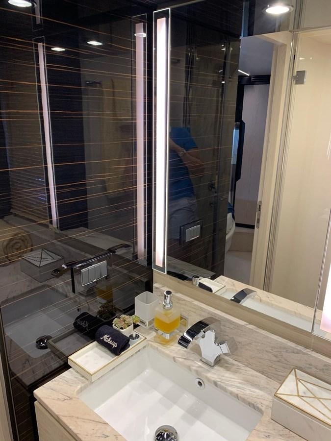 a bathroom with a large mirror aboard AMALFI Yacht for Sale