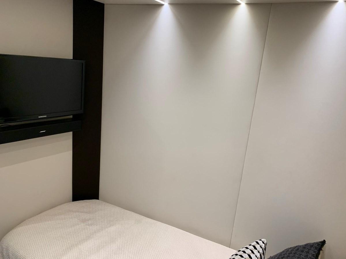 a white wall with a television on it aboard AMALFI Yacht for Sale