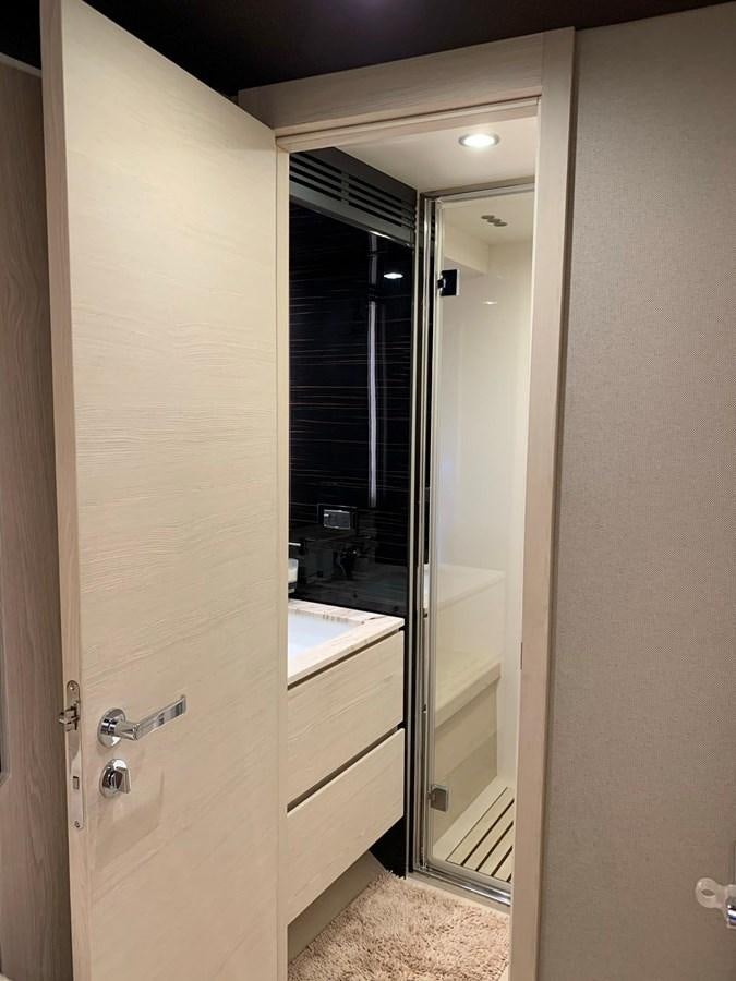 a bathroom with a glass shower aboard AMALFI Yacht for Sale