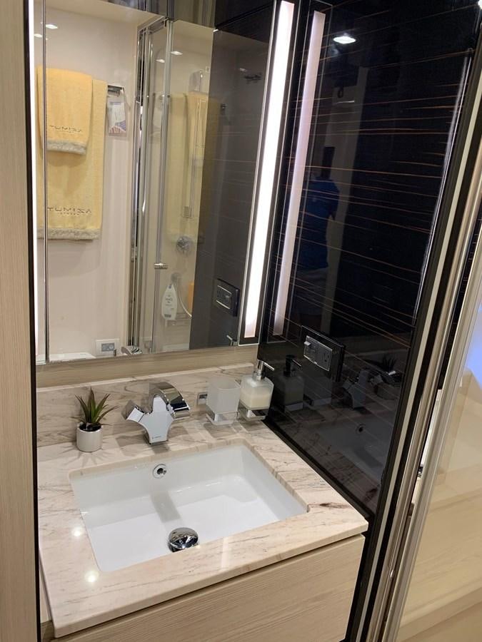 a bathroom with a large mirror aboard AMALFI Yacht for Sale