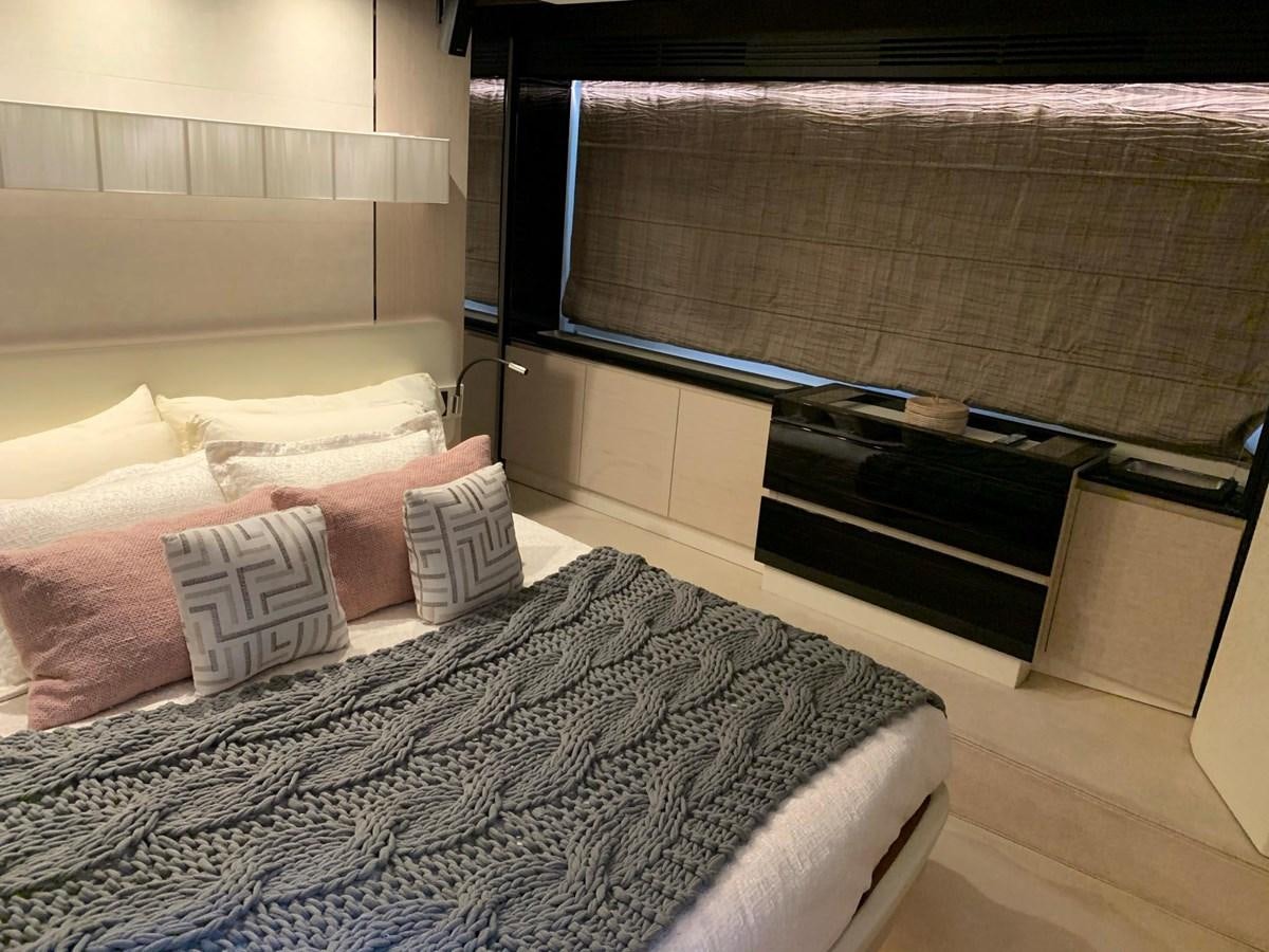 a bed with pillows and a bed aboard AMALFI Yacht for Sale