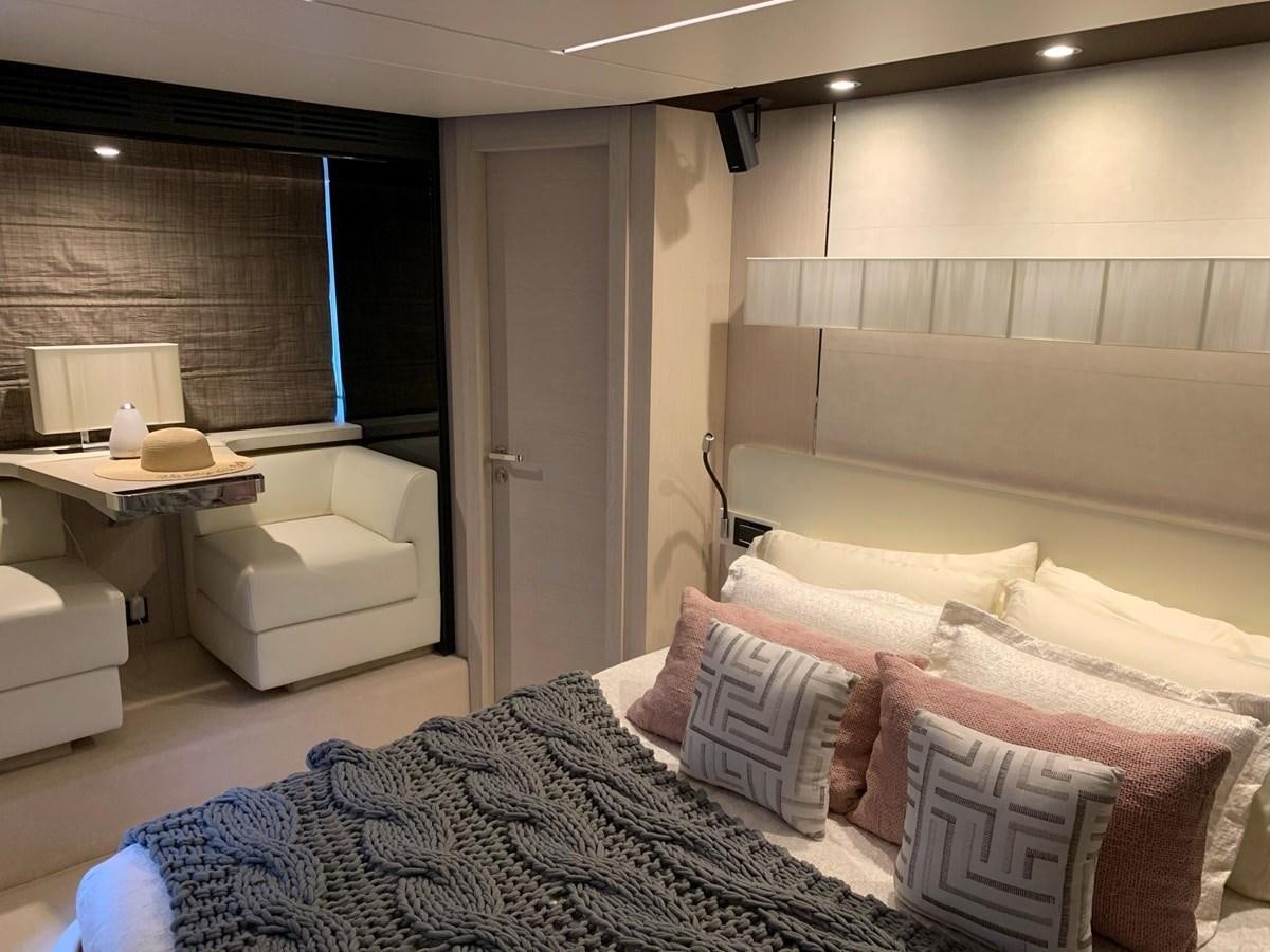 a room with a bed and a desk aboard AMALFI Yacht for Sale