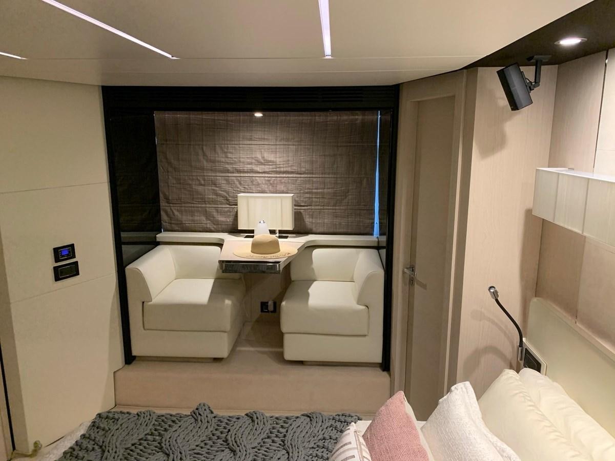 a room with a bed and a desk aboard AMALFI Yacht for Sale