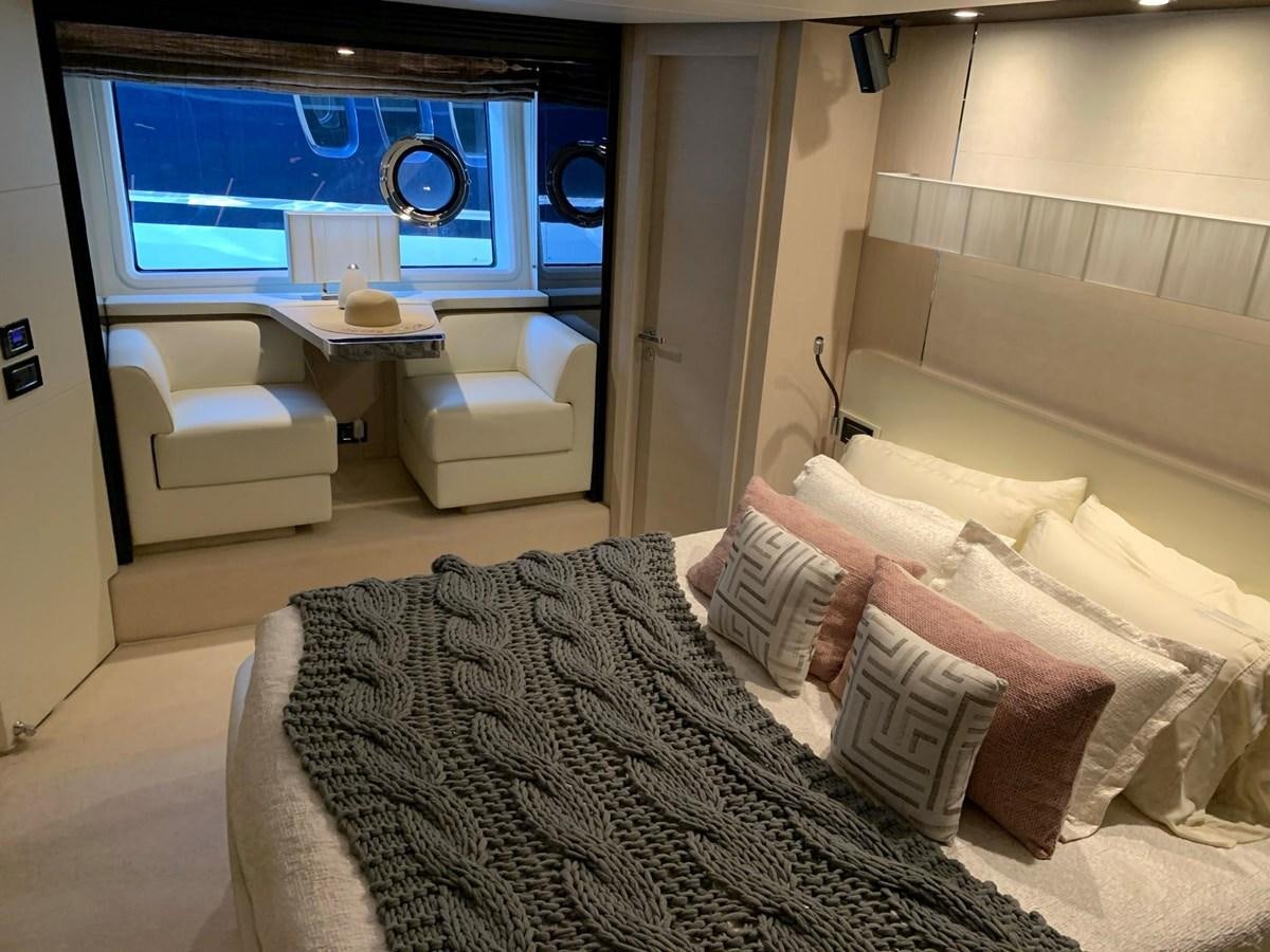 a room with a bed and a tv on the wall aboard AMALFI Yacht for Sale