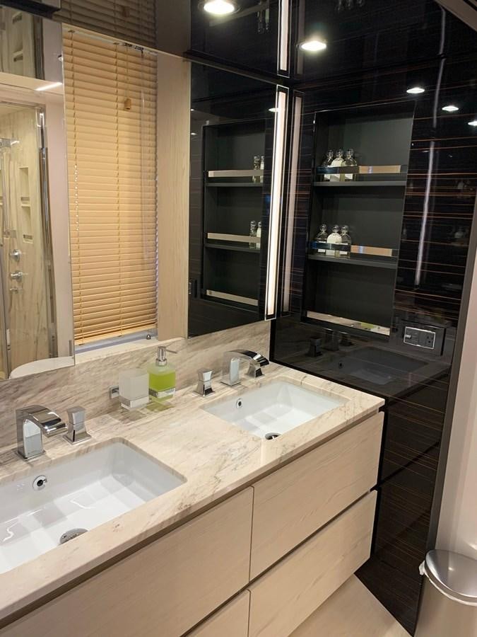 a bathroom with two sinks aboard AMALFI Yacht for Sale