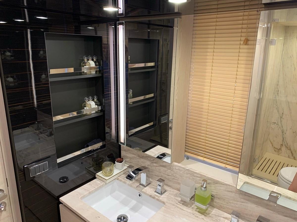 a kitchen with a sink and a microwave aboard AMALFI Yacht for Sale