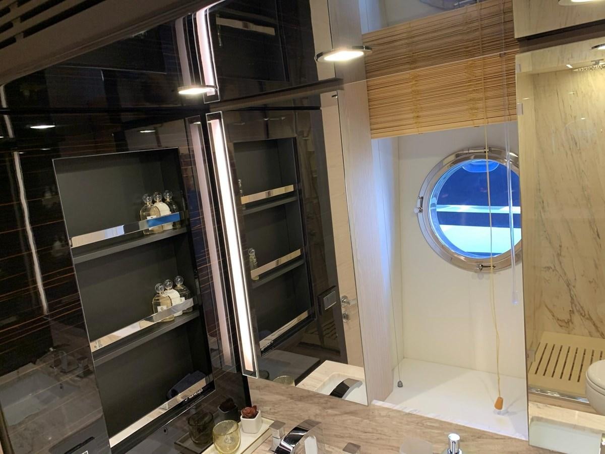 a room with a glass door and a window aboard AMALFI Yacht for Sale