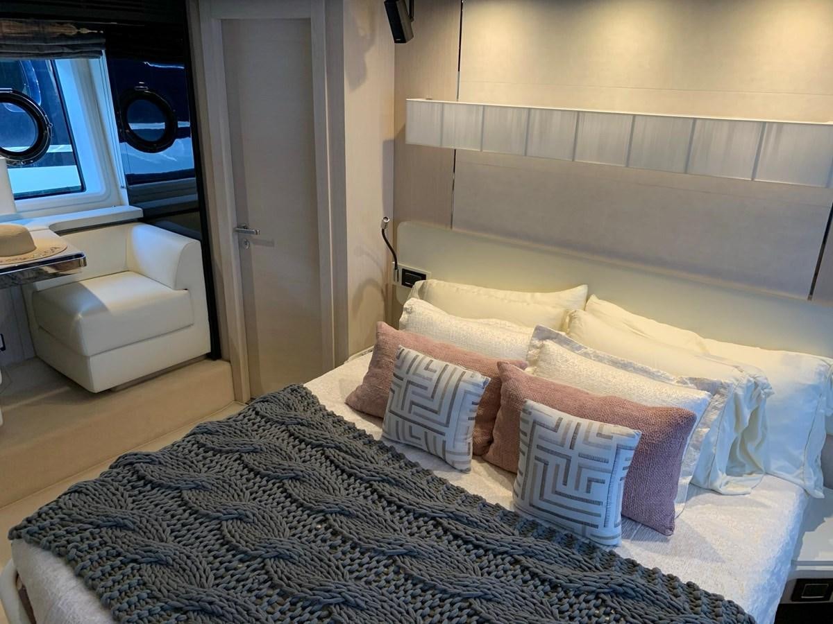 a bed with pillows aboard AMALFI Yacht for Sale