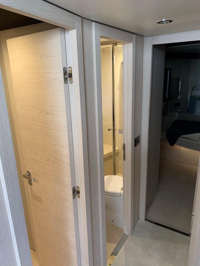 a white door with a mirror aboard AMALFI Yacht for Sale