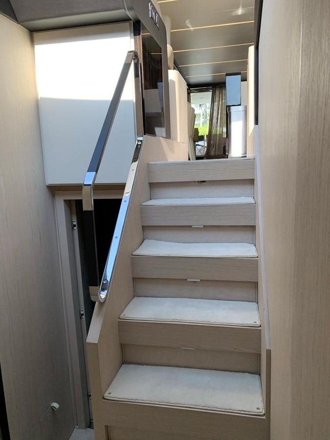 a set of wooden stairs aboard AMALFI Yacht for Sale